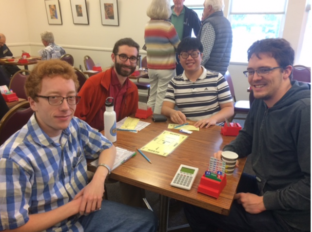 Current and former VdW Group members: Andrew Rowberg (left), Michael Swift (second-from-left), and Nicholas Adamski (right) playing bridge