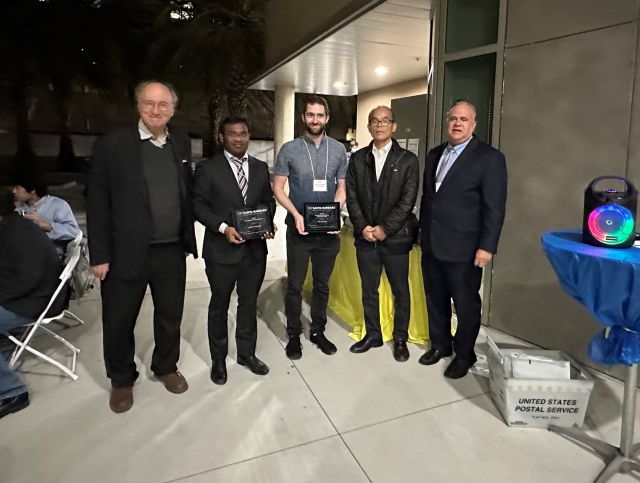 Dr. Mark Turiansky receiving the Outstanding Researcher award from SSLEEC